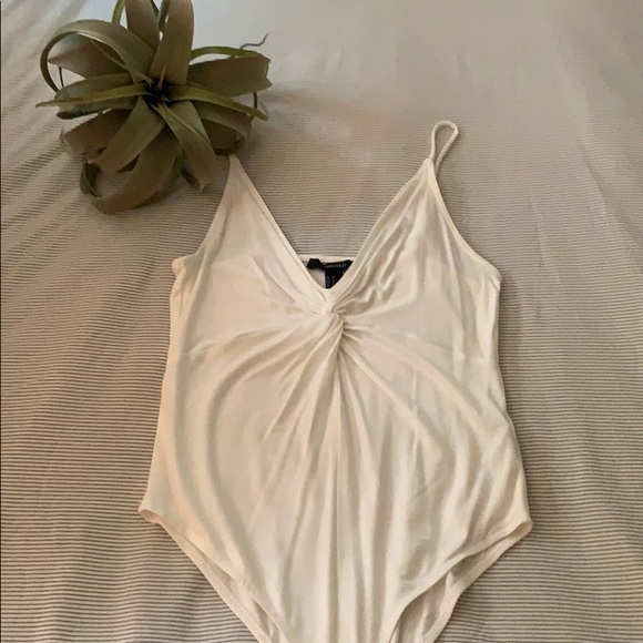 Forever 21 Tops - White body suit. Twisted front.